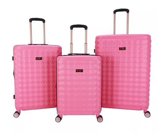 Bright pink three piece luggage set